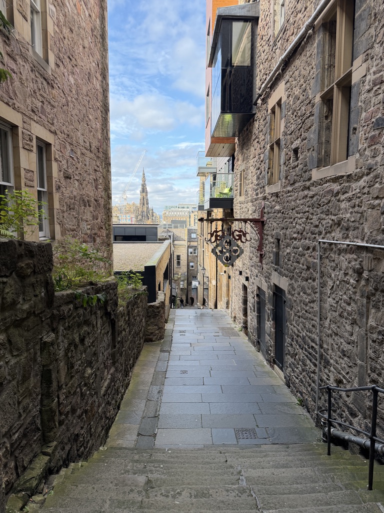 A steep stone close off Edinburgh's Royal Mile, looking toward the Scott Monument.